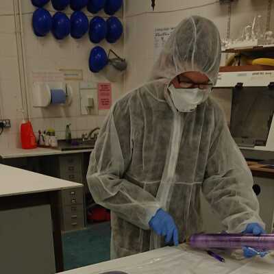 Someone in PPE making face shields