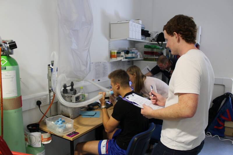 A man using respiratory equipment whilst being monitored