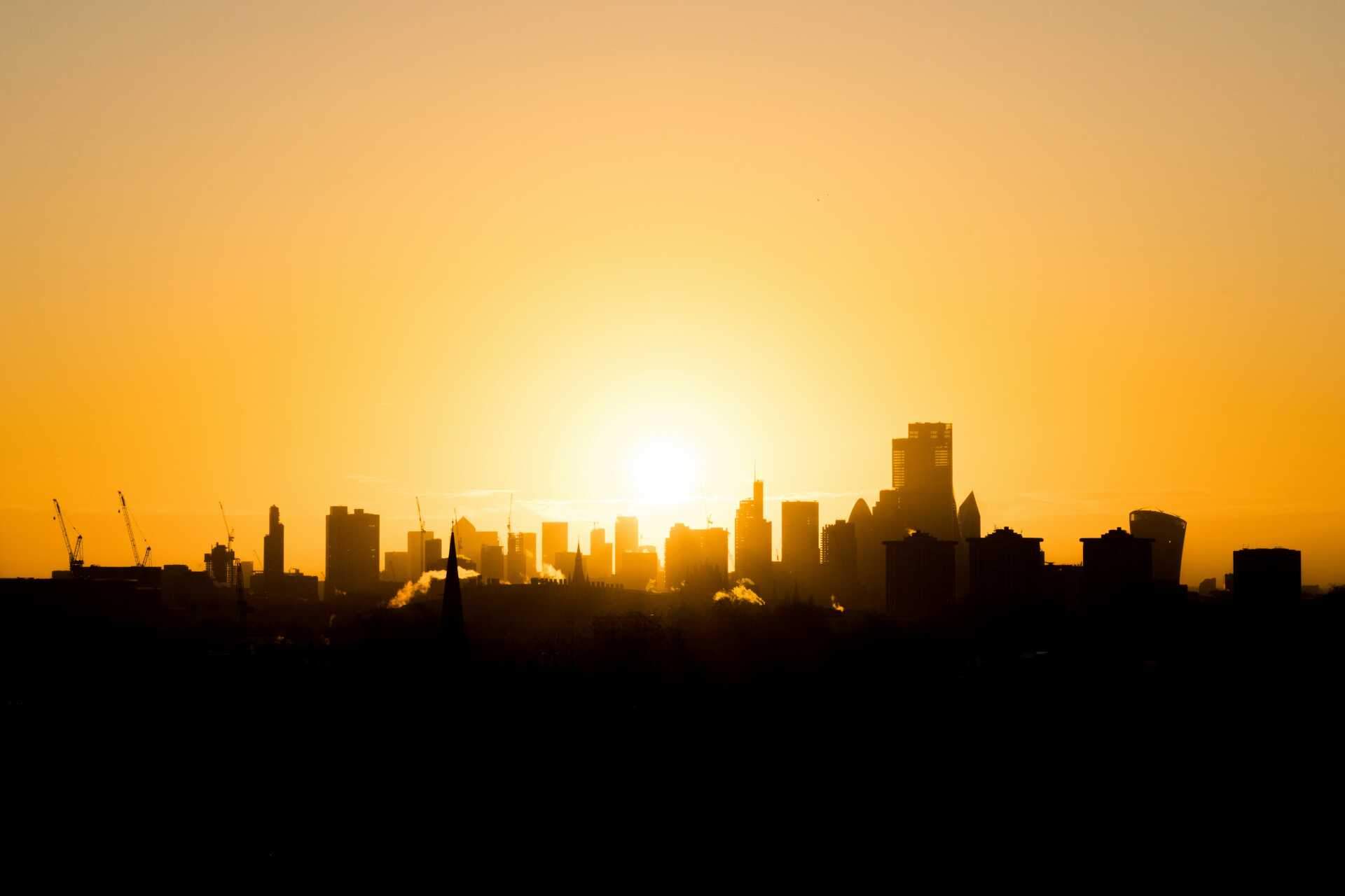 Sunrise over a city skyline