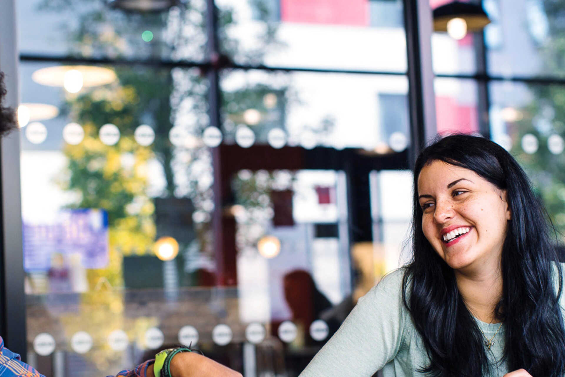 Two students sitting outside CARGO, Medway