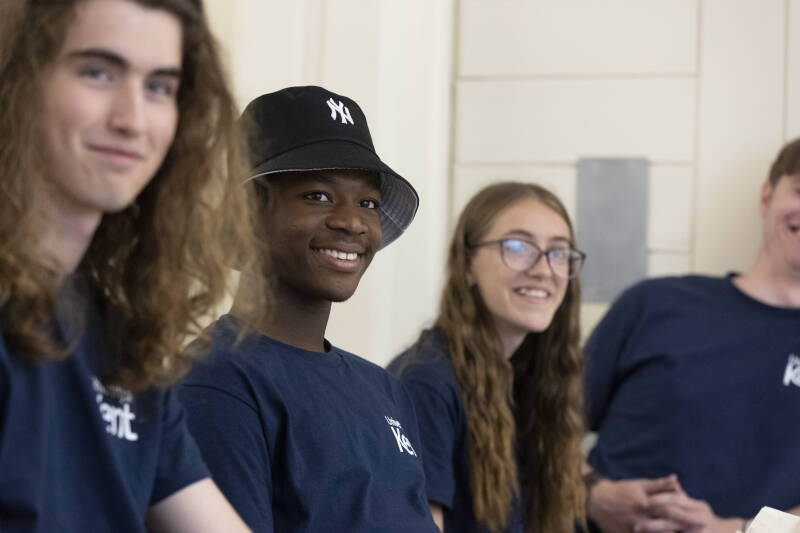 Science teacher creates smoke from a beaker in a chemistry laboratory